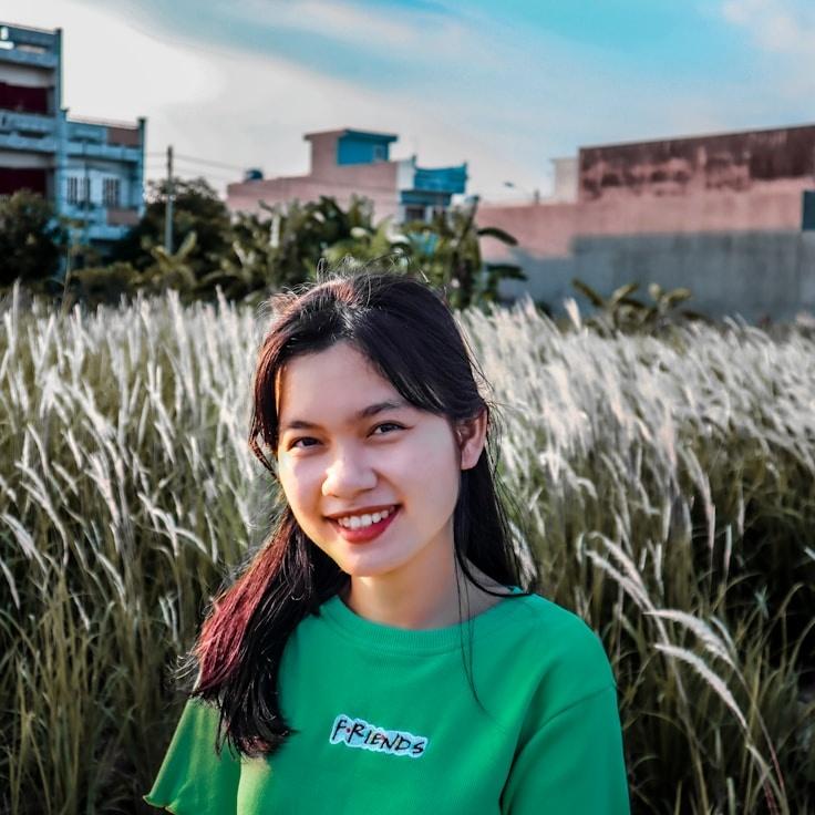 Kaveri Mehta, Lead Design Curator at Meadow Paper Trail, reviewing corporate floral arrangements